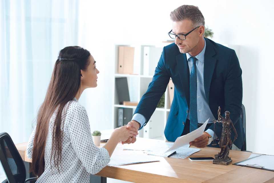 Young woman consulting an employment lawyer